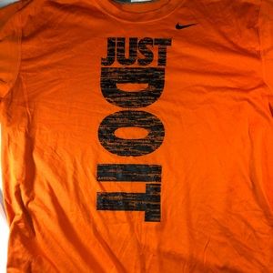 Men's orange Nike shirt in medium